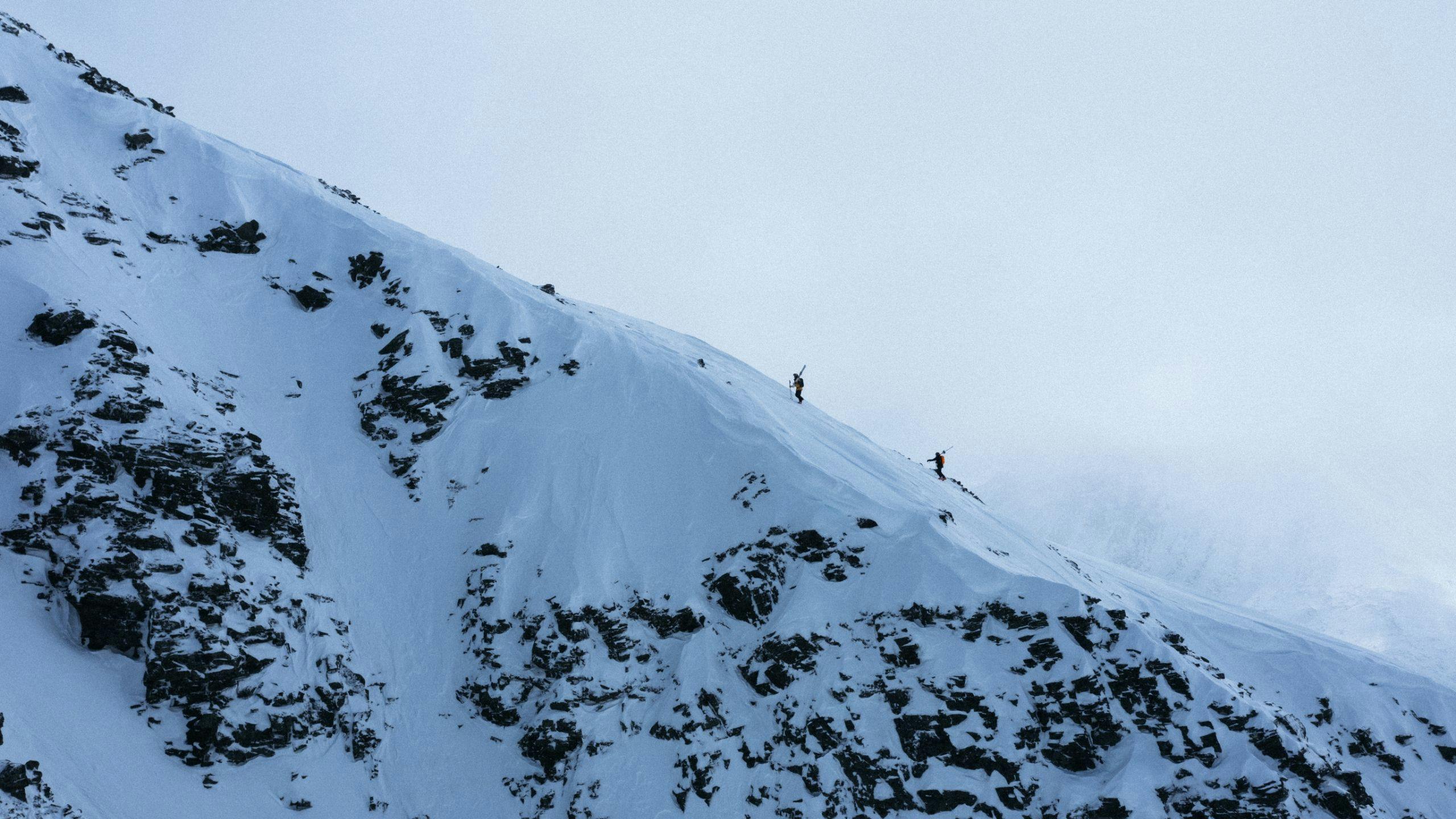 Image of Craig Murray and Kristofer Turdell touring up a ridge